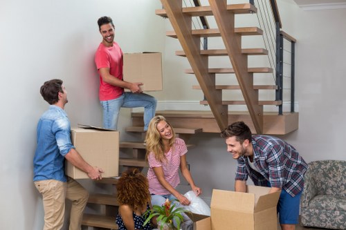 Moving van loading boxes and furniture at the start of a relocation service