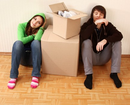 Packed boxes and moving equipment prepared for urgent removals