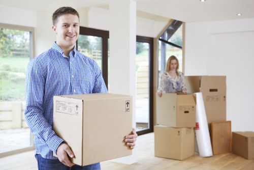 Professional movers handling furniture during a relocation