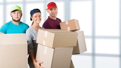 Professional team handling piano removals in a Mayfair property