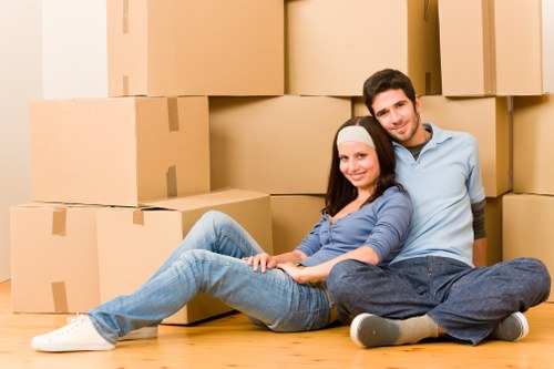Moving boxes and protected furniture in a Mayfair home relocation