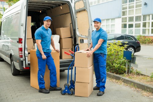 Professional movers loading items safely into a removal vehicle
