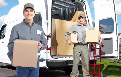 A polished moving team preparing furniture for transport in Mayfair