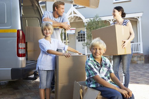Careful loading of furniture from a Mayfair home with narrow access