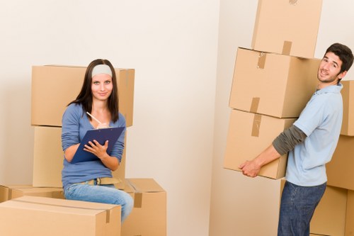 Staff managing heavy items safely during a home relocation